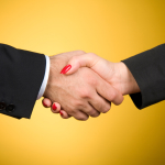 man woman handshake shake hands iStock_000010387373Small
