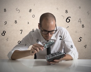 Businessman calculates numbers