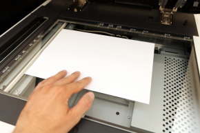 A person electronically scanning a document