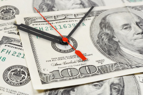 Time is money : clock hands on $100 bills