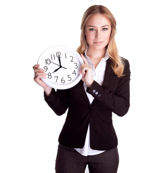 Businesswoman holding a clock