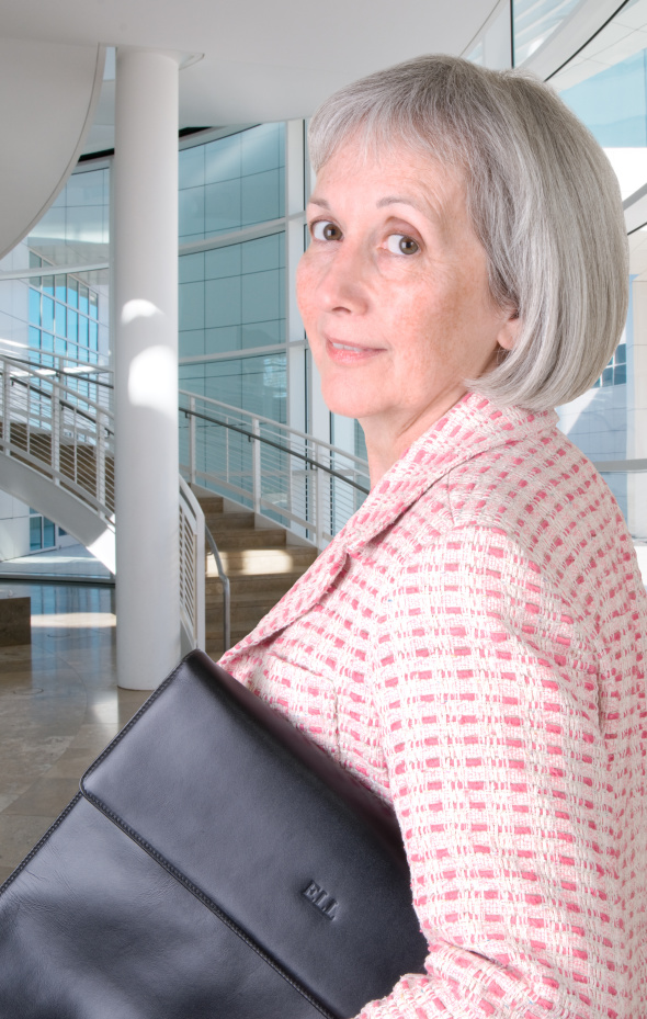 Senior businesswoman holding portfolio