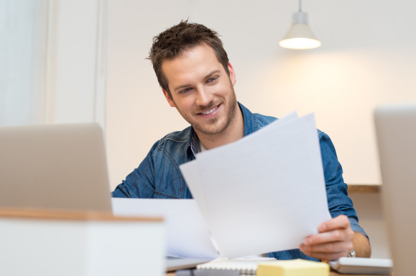 Young man working in home office