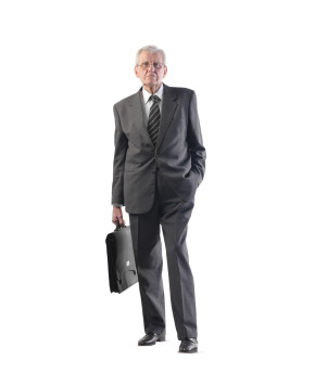 Senior businessman holding briefcase
