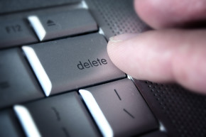 Finger pressing delete key