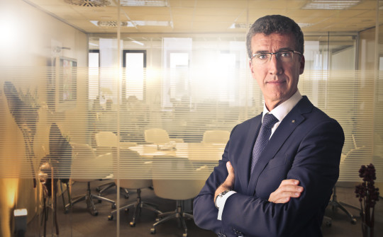 Businessman wearing glasses, suit and serious expression