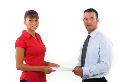 Woman and man holding same document
