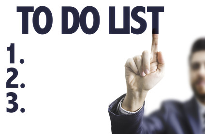 Businessman writing to do list