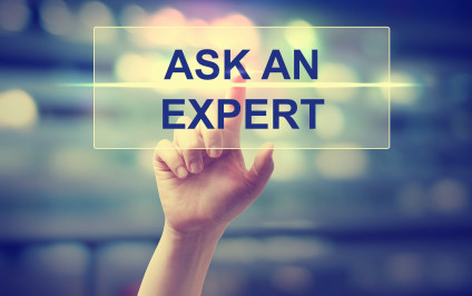 Woman's hand pressing words "ASK AN EXPERT"