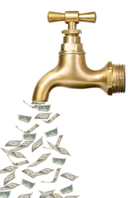 Golden vintage tap with money flowing out