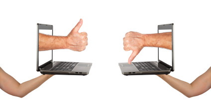"Good vs. evil in technology" illustration using laptops