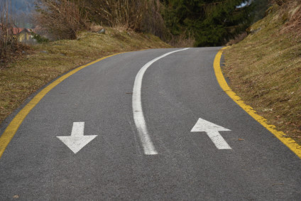 Road with painted arrows heading two directions