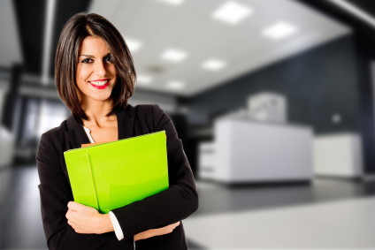 Businesswoman holding green folder