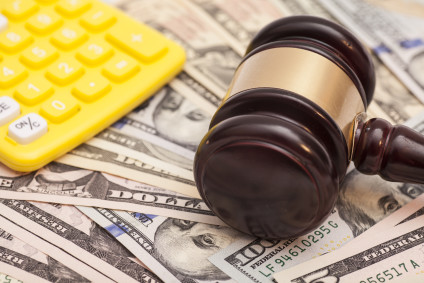 judge gavel,dollar banknotes and calculators