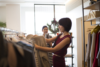 Asian woman shopping for clothes