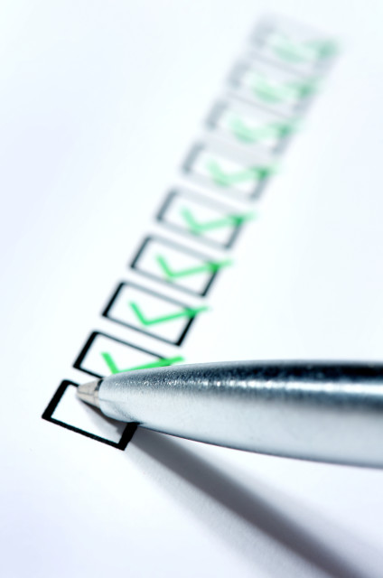 Green checks being made on checklist