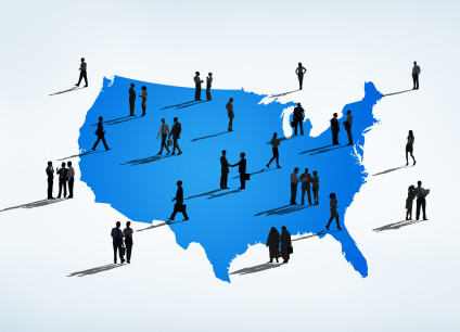 Silhouetted figures against US outline map