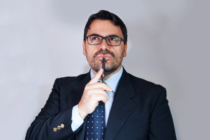 Businessman looking thoughtful