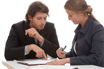 Man and woman reviewing a document
