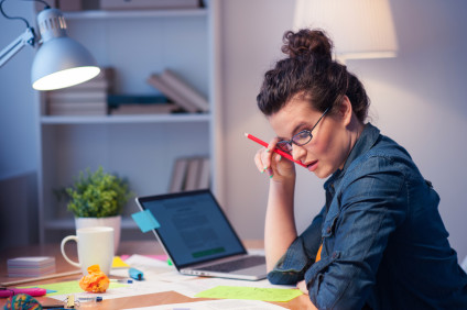 Businesswoman working late at desk