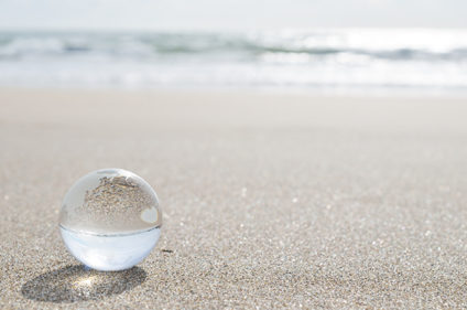 Clear glass marble on a beach