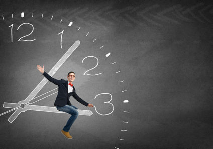 Young man riding hour hand of clock