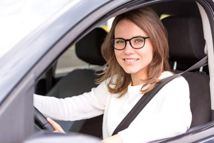 Young woman driving a car
