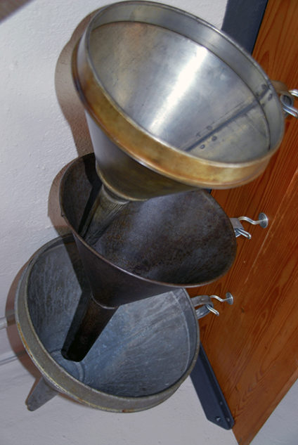 3 metal funnels
