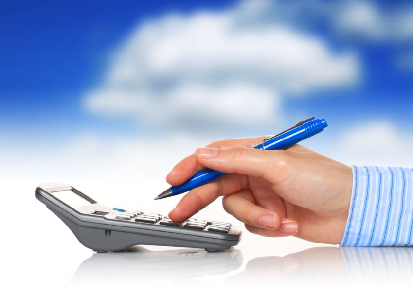 Accountant. Calculator and hand isolated over white.