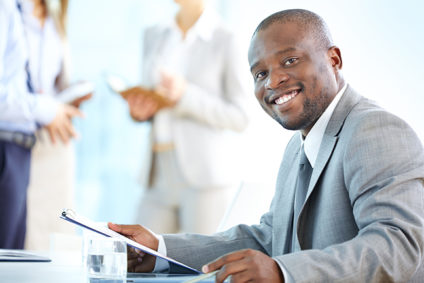 Portrait of a cheerful businessman smiling at the camera