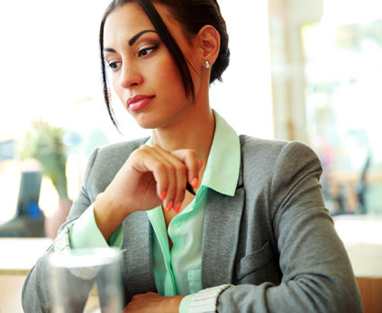 Portrait of a thoughtful businesswoman looking away in office