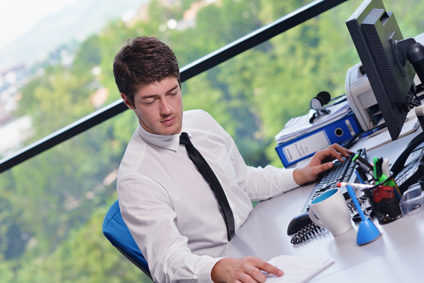 Young businessman working at computer