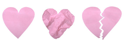 Three paper hearts: one whole, one crumpled, one torn