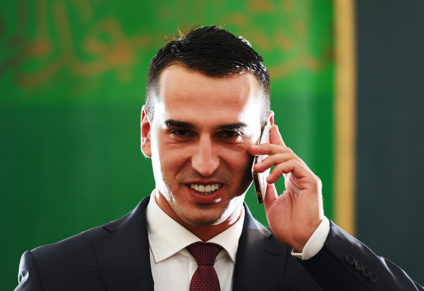 Businessman smiling and talking on phone