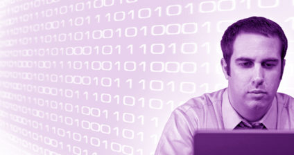 Businessman working on laptop with binary code in the background