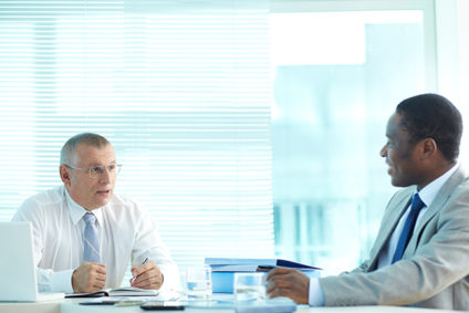 Senior businessman and another businessman talking