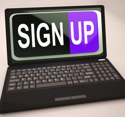 Laptop with "SIGN UP" on screen