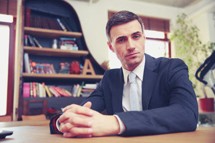 Confident businessman sitting in office