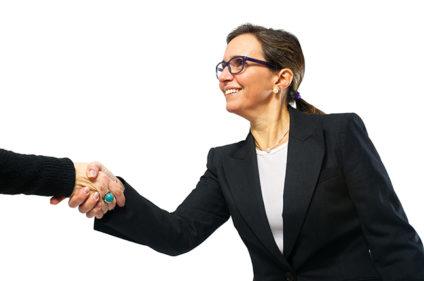 Businesswoman shaking hands with someone out of view