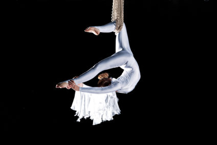 Young woman acrobat performing