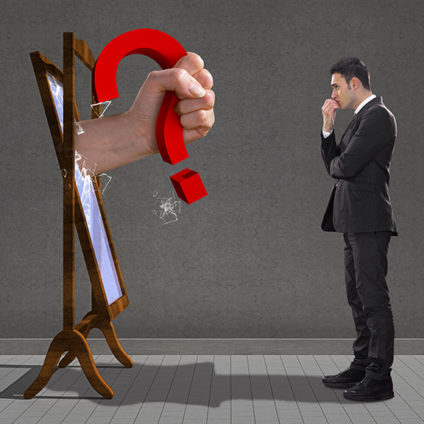 Man facing mirror that has bursting out of it a hand holding a red question mark
