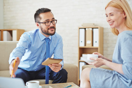 Man and woman having business meeting over coffee