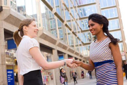 Two businesswomen shaking hands