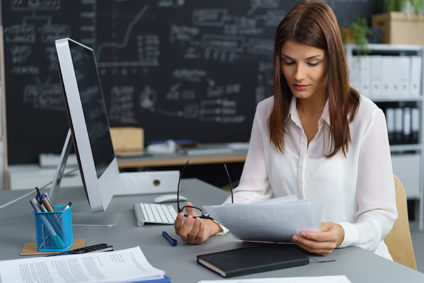 Woman examining document