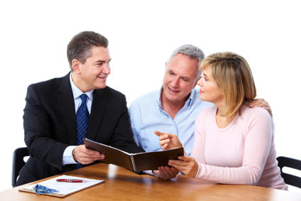 Businessman talking with older couple