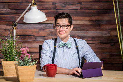 Woman working on tablet in office