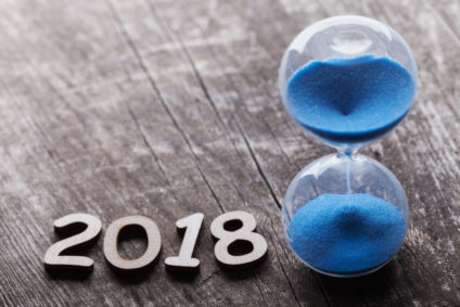 Hourglass on rustic wooden table